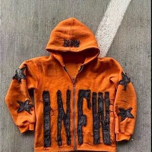 Unlisted Orange Kids Hoodie with Black Lettering and Stars